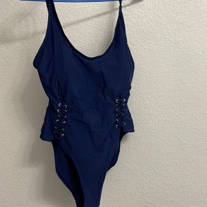 Brand new. Never worn one-piece swim suit.